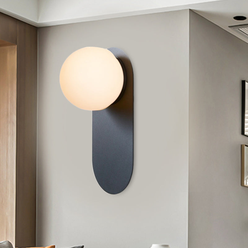 Iron Elliptical Flush Mount Minimalist 1 Bulb Black Wall Sconce Light with Orb Glass Shade Clearhalo 'Cast Iron' 'Glass' 'Industrial' 'Modern wall lights' 'Modern' 'Tiffany' 'Traditional wall lights' 'Wall Lamps & Sconces' 'Wall Lights' Lighting' 1788528