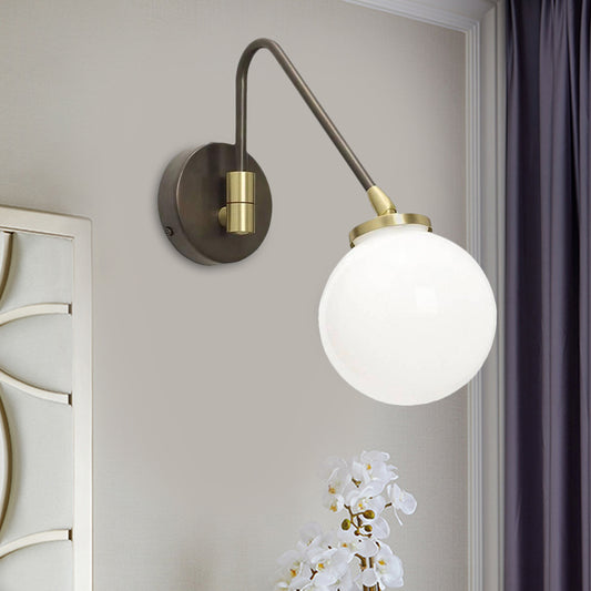 Minimalism Orb White Glass Wall Light 1 Head Sconce Light Fixture with Black-Gold Angled Arm White Clearhalo 'Cast Iron' 'Glass' 'Industrial' 'Modern wall lights' 'Modern' 'Tiffany' 'Traditional wall lights' 'Wall Lamps & Sconces' 'Wall Lights' Lighting' 1788544