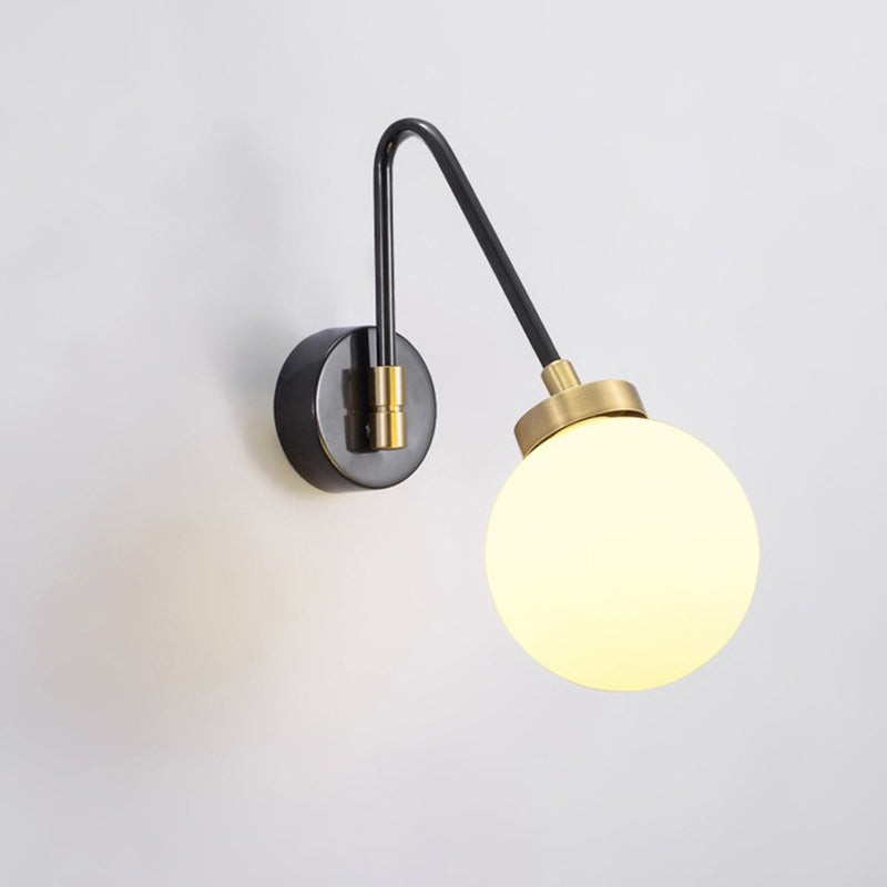 Minimalism Orb White Glass Wall Light 1 Head Sconce Light Fixture with Black-Gold Angled Arm Clearhalo 'Cast Iron' 'Glass' 'Industrial' 'Modern wall lights' 'Modern' 'Tiffany' 'Traditional wall lights' 'Wall Lamps & Sconces' 'Wall Lights' Lighting' 1788546