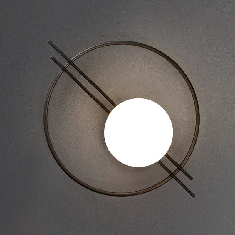 Circle Lounge Sconce Light Iron 1 Head Postmodern Wall Mounted Lighting in Black/Brass with Ball White Glass Shade Clearhalo 'Cast Iron' 'Glass' 'Industrial' 'Modern wall lights' 'Modern' 'Tiffany' 'Traditional wall lights' 'Wall Lamps & Sconces' 'Wall Lights' Lighting' 1788580