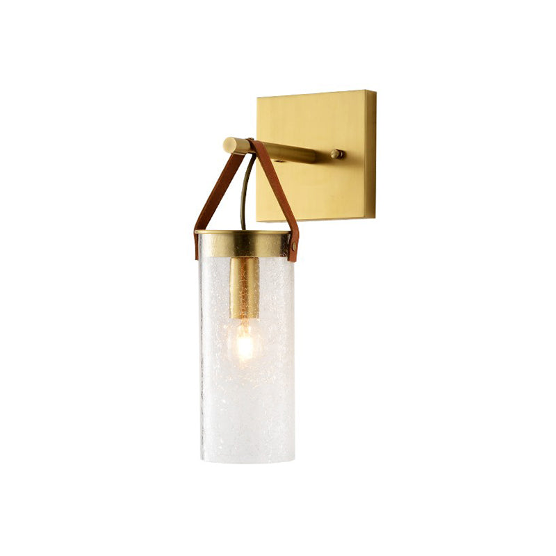 Postmodern Cylindrical Sconce Ideas Clear Crack Glass 1 Head Dining Room Wall Mounted Lamp in Brass with Leather Strap Clearhalo 'Cast Iron' 'Glass' 'Industrial' 'Modern wall lights' 'Modern' 'Tiffany' 'Traditional wall lights' 'Wall Lamps & Sconces' 'Wall Lights' Lighting' 1788611