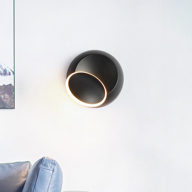 Black/White Rotating Ellipse Wall Lamp Modern Novelty Iron LED Surface Wall Sconce with Simulated Eclipse Design Clearhalo 'Cast Iron' 'Glass' 'Industrial' 'Modern wall lights' 'Modern' 'Tiffany' 'Traditional wall lights' 'Wall Lamps & Sconces' 'Wall Lights' Lighting' 1788984