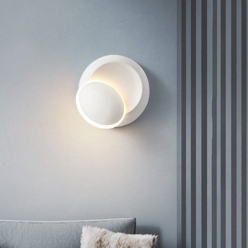 Black/White Rotating Ellipse Wall Lamp Modern Novelty Iron LED Surface Wall Sconce with Simulated Eclipse Design White Clearhalo 'Cast Iron' 'Glass' 'Industrial' 'Modern wall lights' 'Modern' 'Tiffany' 'Traditional wall lights' 'Wall Lamps & Sconces' 'Wall Lights' Lighting' 1788987