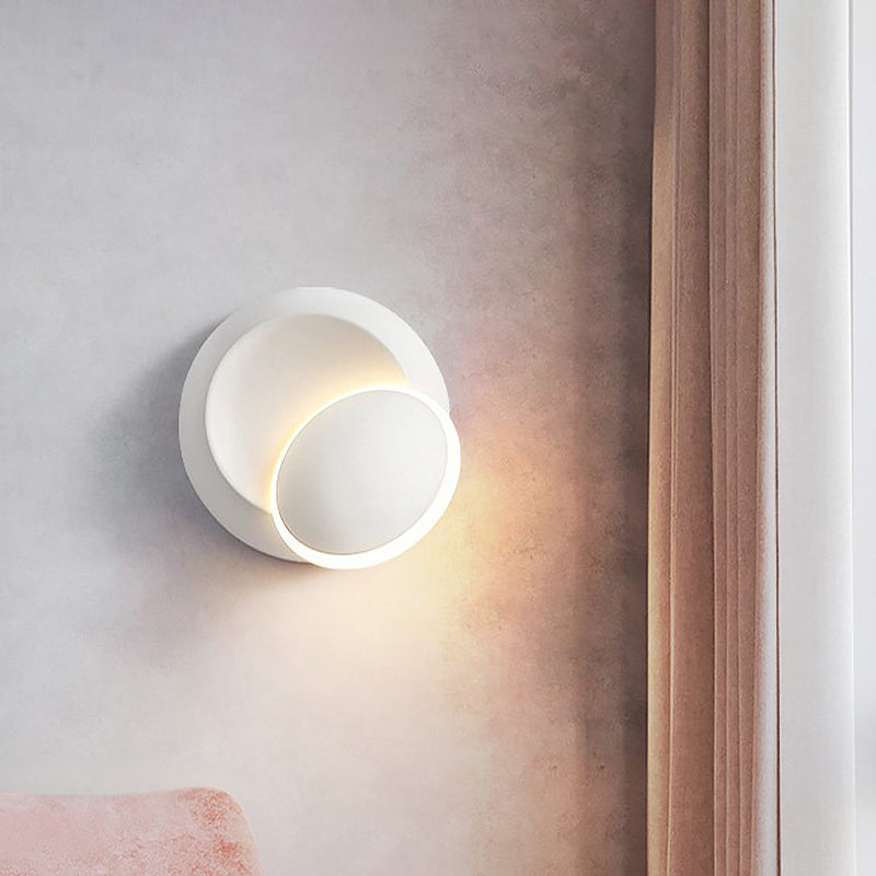 Black/White Rotating Ellipse Wall Lamp Modern Novelty Iron LED Surface Wall Sconce with Simulated Eclipse Design Clearhalo 'Cast Iron' 'Glass' 'Industrial' 'Modern wall lights' 'Modern' 'Tiffany' 'Traditional wall lights' 'Wall Lamps & Sconces' 'Wall Lights' Lighting' 1788988