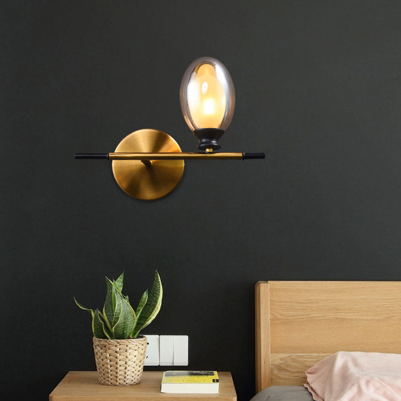 Brass Straight Rod Wall Lamp Mid Century 1 Head Metal Sconce Ideas with Dual Oval Clear/Amber Glass Shade Clearhalo 'Cast Iron' 'Glass' 'Industrial' 'Modern wall lights' 'Modern' 'Tiffany' 'Traditional wall lights' 'Wall Lamps & Sconces' 'Wall Lights' Lighting' 1789118