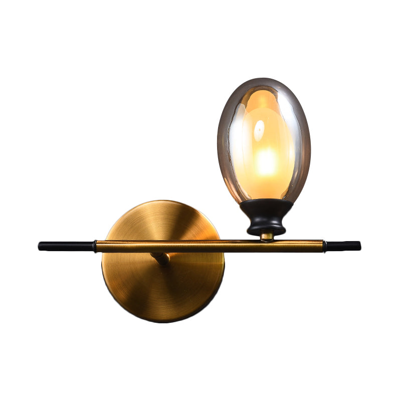 Brass Straight Rod Wall Lamp Mid Century 1 Head Metal Sconce Ideas with Dual Oval Clear/Amber Glass Shade Clearhalo 'Cast Iron' 'Glass' 'Industrial' 'Modern wall lights' 'Modern' 'Tiffany' 'Traditional wall lights' 'Wall Lamps & Sconces' 'Wall Lights' Lighting' 1789120