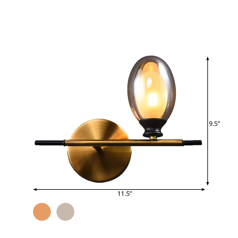 Brass Straight Rod Wall Lamp Mid Century 1 Head Metal Sconce Ideas with Dual Oval Clear/Amber Glass Shade Clearhalo 'Cast Iron' 'Glass' 'Industrial' 'Modern wall lights' 'Modern' 'Tiffany' 'Traditional wall lights' 'Wall Lamps & Sconces' 'Wall Lights' Lighting' 1789122