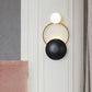 Postmodern Orbital Flush Mount Iron 2-Light Parlor Wall Sconce Light in Black-Gold with Orb Opal Glass Shade Clearhalo 'Cast Iron' 'Glass' 'Industrial' 'Modern wall lights' 'Modern' 'Tiffany' 'Traditional wall lights' 'Wall Lamps & Sconces' 'Wall Lights' Lighting' 1789440