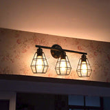 Caged Shade Bathroom Wall Lamp Sconce Industrial Style Metal 3 Lights Black Wall Mount Light Clearhalo 'Art deco wall lights' 'Cast Iron' 'Glass' 'Industrial wall lights' 'Industrial' 'Middle century wall lights' 'Modern' 'Rustic wall lights' 'Tiffany' 'Traditional wall lights' 'Vanity Lights' 'Wall Lights' Lighting' 1797030