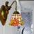 Sunflower Sconce Light Tiffany Orange Glass 1 Head Living Room Wall Mounted Light with Mermaid Backplate Orange Clearhalo 'Industrial' 'Middle century wall lights' 'Tiffany wall lights' 'Tiffany' 'Wall Lamps & Sconces' 'Wall Lights' Lighting' 179926