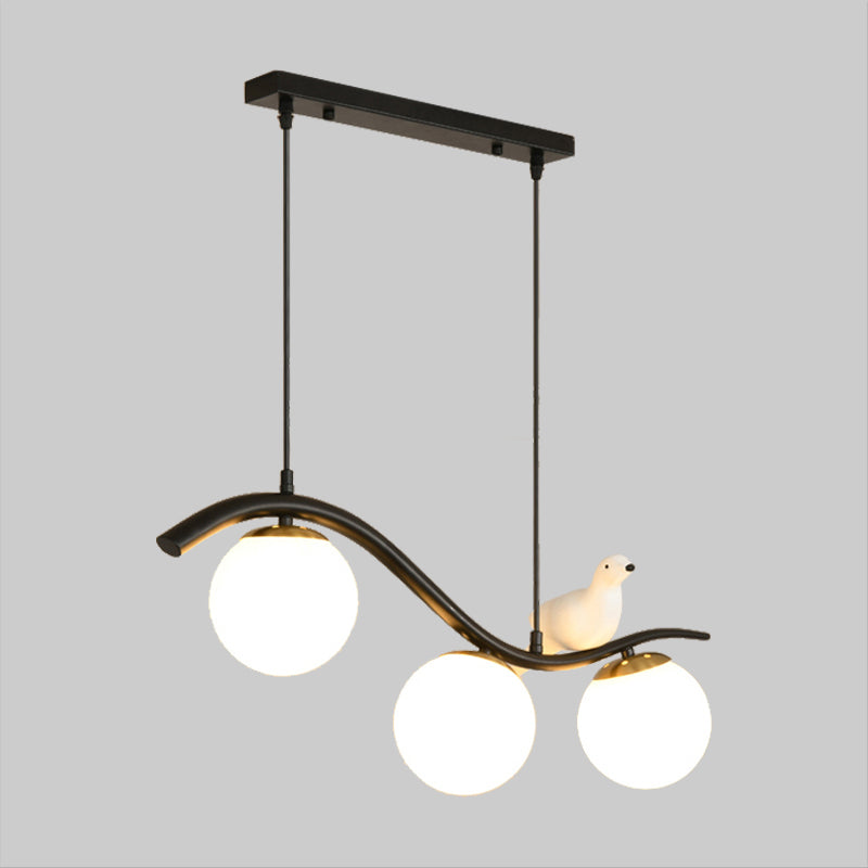 Ball Shade Hanging Lamp Kit Modernism Clear/White Glass 3 Heads Black Island Lighting with Pigeon Decor Clearhalo 'Ceiling Lights' 'Close To Ceiling Lights' 'Glass shade' 'Glass' 'Island Lights' Lighting' 1865757