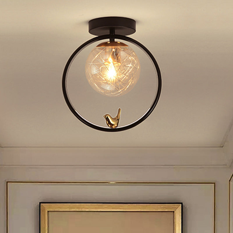 Spherical Semi Flush Light Contemporary Clear Glass Single Bulb Black Ceiling Mounted Fixture with Globe/Bird Decor Black Bird Clearhalo 'Ceiling Lights' 'Close To Ceiling Lights' 'Close to ceiling' 'Glass shade' 'Glass' 'Pendant Lights' 'Semi-flushmount' Lighting' 1865786