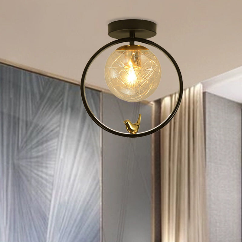 Spherical Semi Flush Light Contemporary Clear Glass Single Bulb Black Ceiling Mounted Fixture with Globe/Bird Decor Clearhalo 'Ceiling Lights' 'Close To Ceiling Lights' 'Close to ceiling' 'Glass shade' 'Glass' 'Pendant Lights' 'Semi-flushmount' Lighting' 1865787