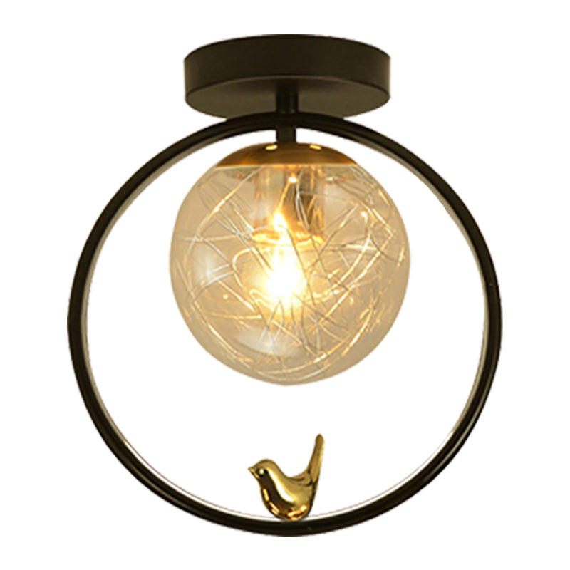 Spherical Semi Flush Light Contemporary Clear Glass Single Bulb Black Ceiling Mounted Fixture with Globe/Bird Decor Clearhalo 'Ceiling Lights' 'Close To Ceiling Lights' 'Close to ceiling' 'Glass shade' 'Glass' 'Pendant Lights' 'Semi-flushmount' Lighting' 1865788