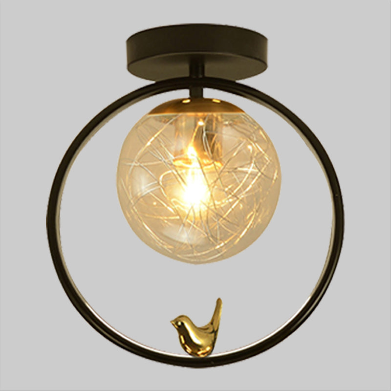 Spherical Semi Flush Light Contemporary Clear Glass Single Bulb Black Ceiling Mounted Fixture with Globe/Bird Decor Clearhalo 'Ceiling Lights' 'Close To Ceiling Lights' 'Close to ceiling' 'Glass shade' 'Glass' 'Pendant Lights' 'Semi-flushmount' Lighting' 1865789