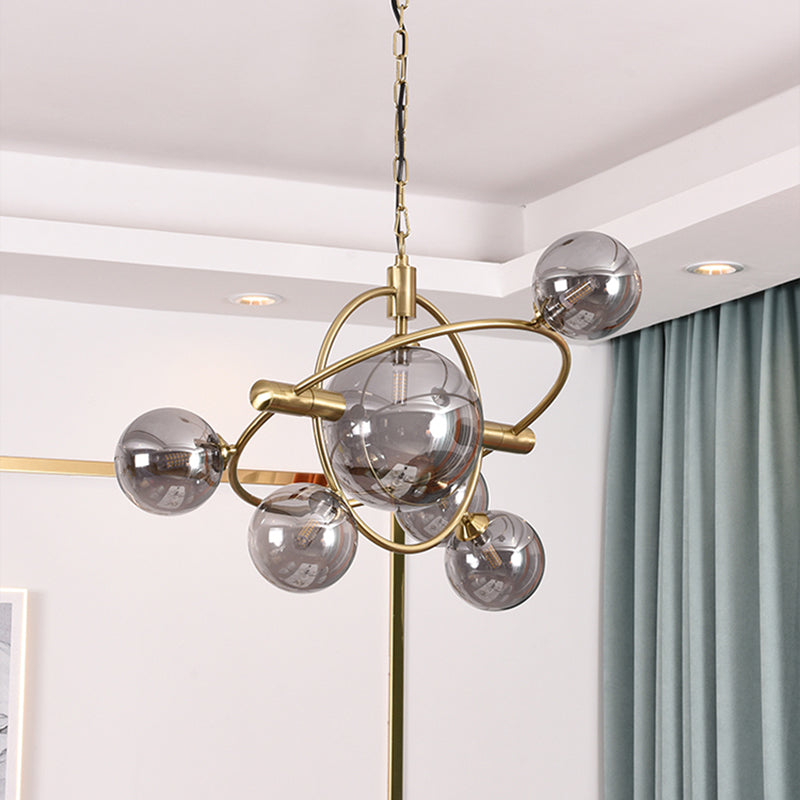 Gold Concentric Ring Pendant Light with Sphere Shade Amber/Clear/Smoke Glass Contemporary Chandelier for Living Room 6 Smoke Gray Clearhalo 'Ceiling Lights' 'Chandeliers' 'Clear' 'Glass shade' 'Glass' 'Industrial' 'Modern Chandeliers' 'Modern' 'Tiffany' 'Traditional Chandeliers' Lighting' 189587
