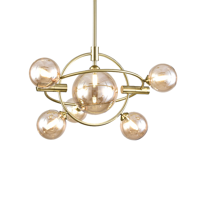 Gold Concentric Ring Pendant Light with Sphere Shade Amber/Clear/Smoke Glass Contemporary Chandelier for Living Room Clearhalo 'Ceiling Lights' 'Chandeliers' 'Clear' 'Glass shade' 'Glass' 'Industrial' 'Modern Chandeliers' 'Modern' 'Tiffany' 'Traditional Chandeliers' Lighting' 189600