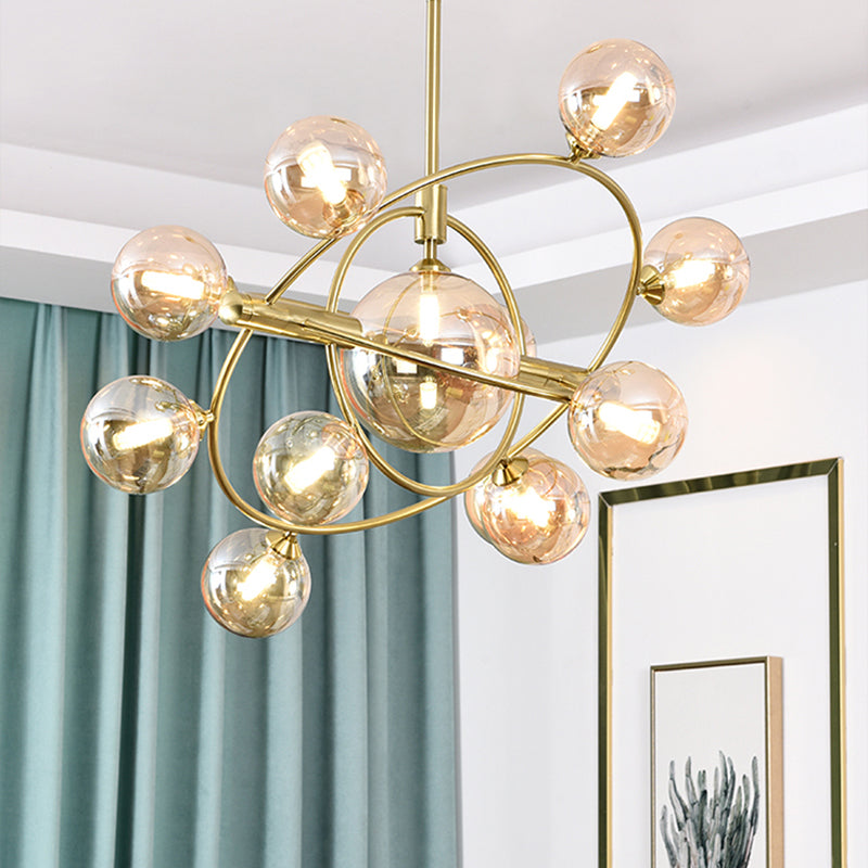 Gold Concentric Ring Pendant Light with Sphere Shade Amber/Clear/Smoke Glass Contemporary Chandelier for Living Room 12 Amber Clearhalo 'Ceiling Lights' 'Chandeliers' 'Clear' 'Glass shade' 'Glass' 'Industrial' 'Modern Chandeliers' 'Modern' 'Tiffany' 'Traditional Chandeliers' Lighting' 189601