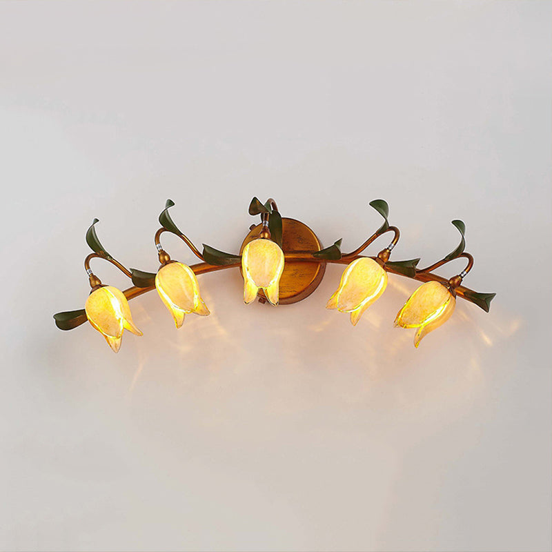 Yellow Flower Vanity Sconce Rustic Glass 3/5 Lights Bathroom Wall Light Fixture with Gold Swirled Arm 5.0 Yellow Clearhalo 'Vanity Lights' 'Wall Lights' Lighting' 1903004