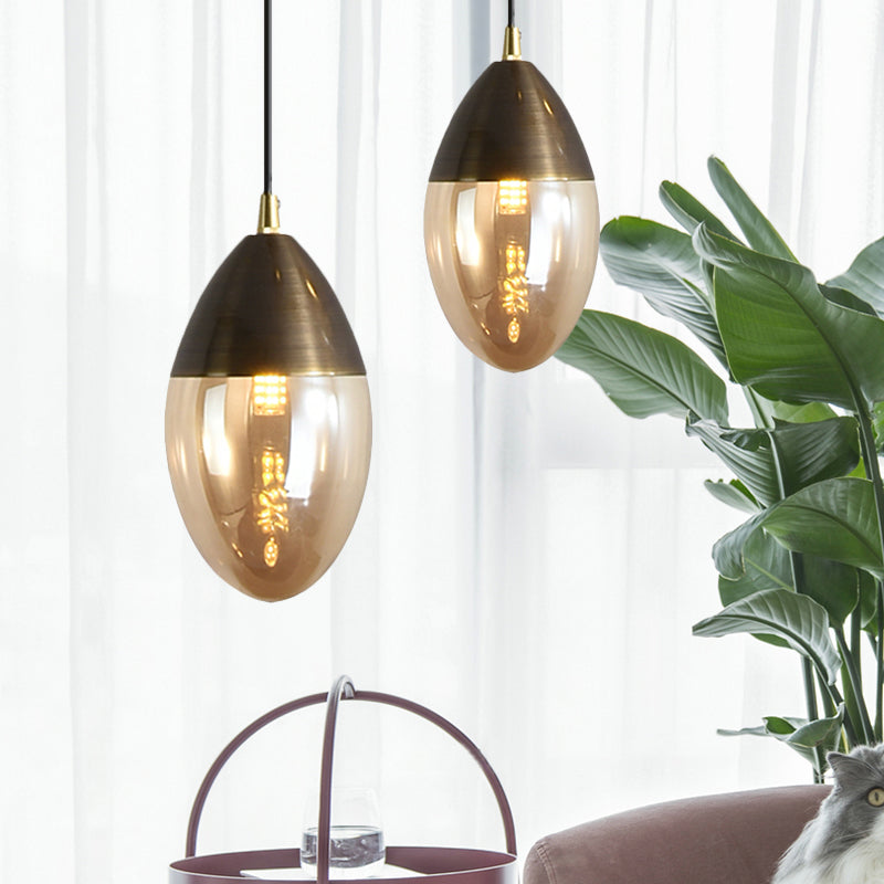 Post Modern Ellipsoid Suspension Pendant Clear/Amber Glass Led Dinging Room Ceiling Hung Light Clearhalo 'Ceiling Lights' 'Glass shade' 'Glass' 'Modern Pendants' 'Modern' 'Pendant Lights' 'Pendants' Lighting' 1903087