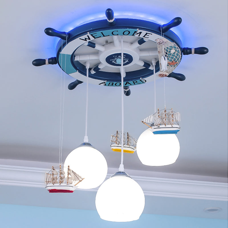 Globe Down Lighting Nautical Opaque Glass 3 Heads Nursery Multiple Lamp Pendant with Rudder Canopy in White Clearhalo 'Ceiling Lights' 'Close To Ceiling Lights' 'Glass shade' 'Glass' 'Pendant Lights' 'Pendants' Lighting' 1907764