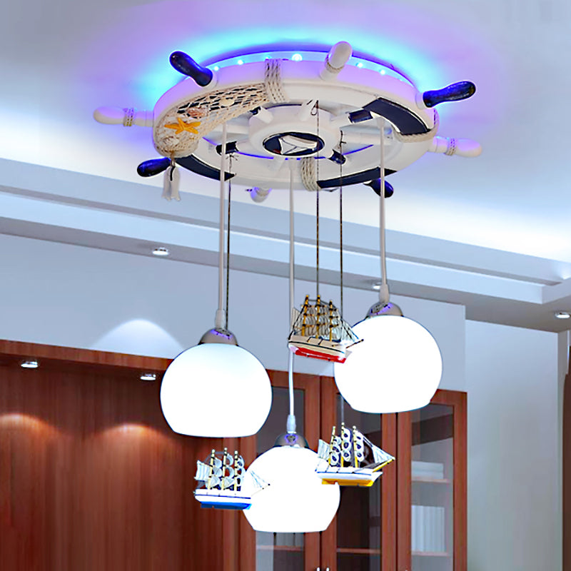 Globe Down Lighting Nautical Opaque Glass 3 Heads Nursery Multiple Lamp Pendant with Rudder Canopy in White Clearhalo 'Ceiling Lights' 'Close To Ceiling Lights' 'Glass shade' 'Glass' 'Pendant Lights' 'Pendants' Lighting' 1907769