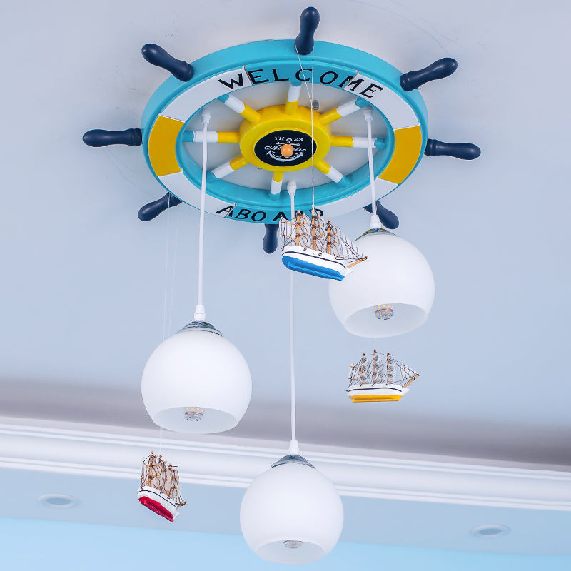 Globe Down Lighting Nautical Opaque Glass 3 Heads Nursery Multiple Lamp Pendant with Rudder Canopy in White Clearhalo 'Ceiling Lights' 'Close To Ceiling Lights' 'Glass shade' 'Glass' 'Pendant Lights' 'Pendants' Lighting' 1907772