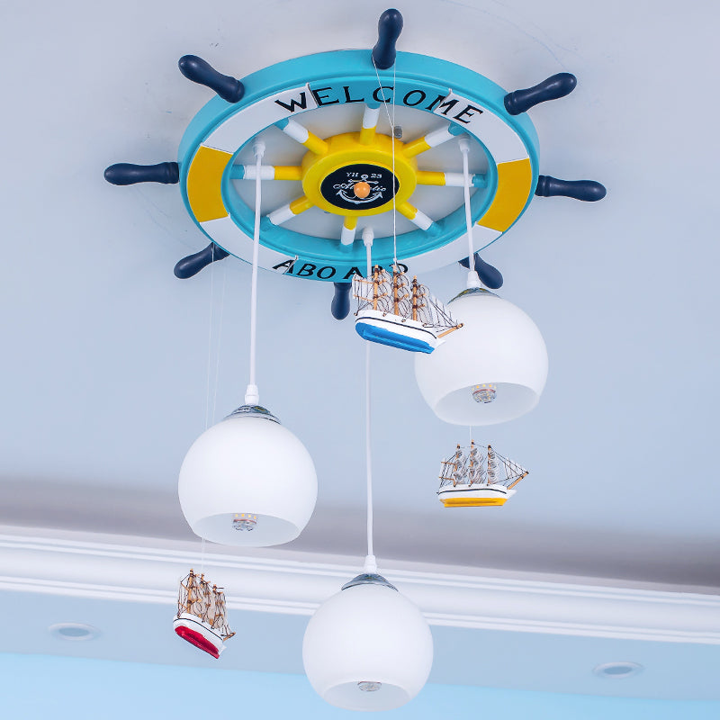 Globe Down Lighting Nautical Opaque Glass 3 Heads Nursery Multiple Lamp Pendant with Rudder Canopy in White Clearhalo 'Ceiling Lights' 'Close To Ceiling Lights' 'Glass shade' 'Glass' 'Pendant Lights' 'Pendants' Lighting' 1907772