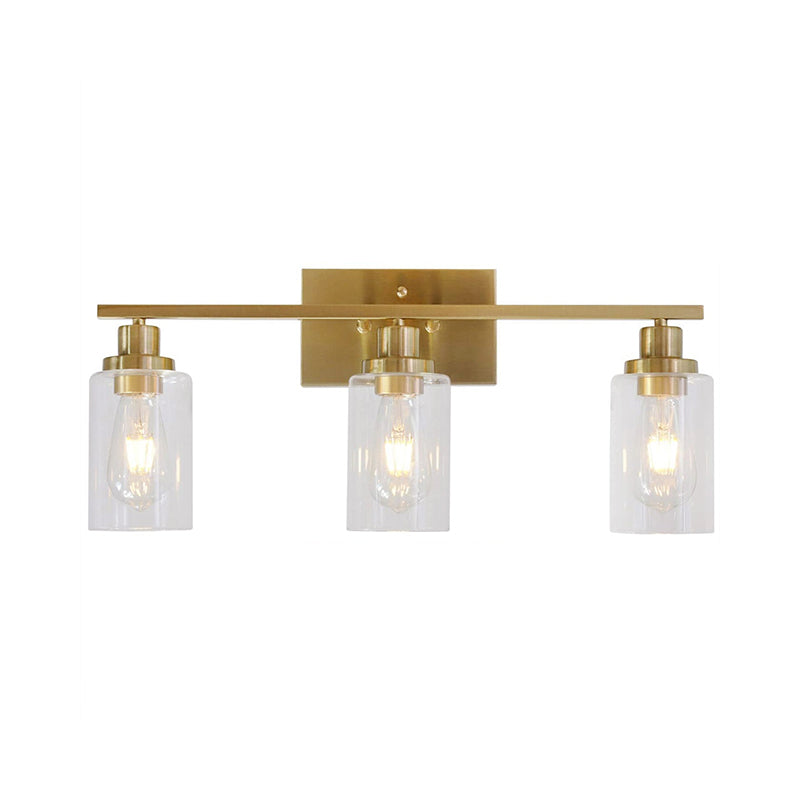 2/3 Bulbs Cylinder Wall Mount Light Industrial Black/Brass/Nickel Clear Glass Wall Lamp Fixture for Bathroom 3.0 Brass Clearhalo 'Art deco wall lights' 'Cast Iron' 'Glass' 'Industrial wall lights' 'Industrial' 'Middle century wall lights' 'Modern' 'Rustic wall lights' 'Tiffany' 'Traditional wall lights' 'Wall Lamps & Sconces' 'Wall Lights' Lighting' 1918790