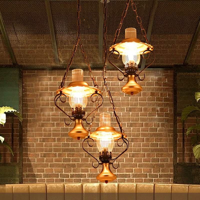 1/3 Lights Cluster Pendant Light with Lantern Industrial Metal and Clear Glass Ceiling Light Fixture for Restaurant 3 Gold Clearhalo 'Cast Iron' 'Ceiling Lights' 'Chandeliers' 'Industrial Chandeliers' 'Industrial' 'Metal' 'Middle Century Chandeliers' 'Rustic Chandeliers' 'Tiffany' Lighting' 1918838