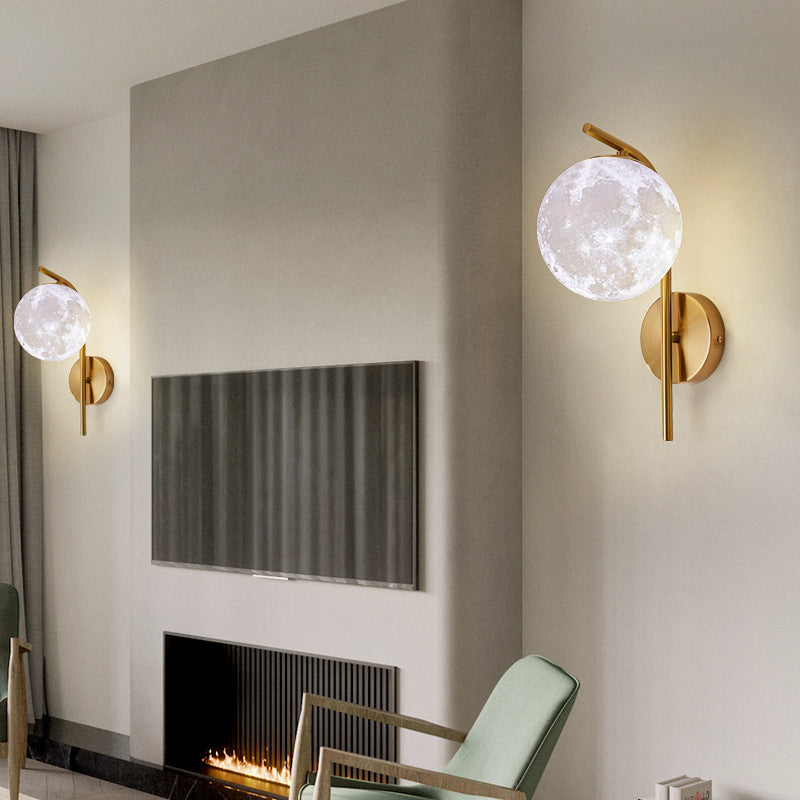 Postmodern Ball Wall Mount Light Grey/Clear Water/White Glass Single-Bulb Bedside Wall Lamp with Bent Arm in Brass Clearhalo 'Cast Iron' 'Glass' 'Industrial' 'Modern wall lights' 'Modern' 'Tiffany' 'Traditional wall lights' 'Wall Lamps & Sconces' 'Wall Lights' Lighting' 1936615