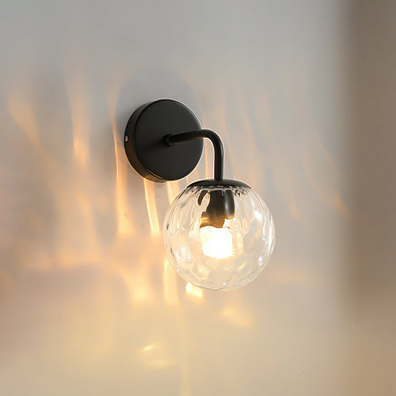Ball Shaped Wall Lamp Minimalist Clear Rippling Glass 1-Light Bedroom Wall Mounted Lighting with Bent Arm in Black/Gold Clearhalo 'Cast Iron' 'Glass' 'Industrial' 'Modern wall lights' 'Modern' 'Tiffany' 'Traditional wall lights' 'Wall Lamps & Sconces' 'Wall Lights' Lighting' 1936633