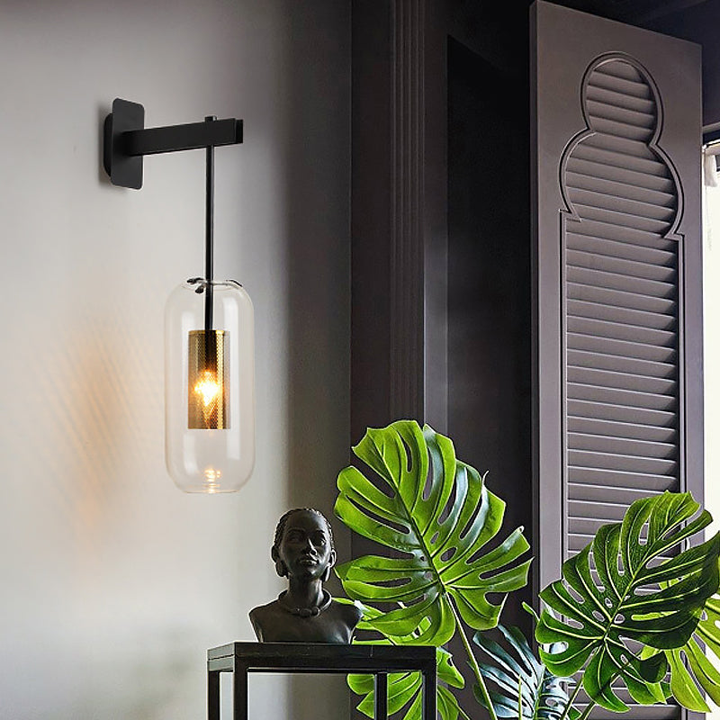 Postmodern Capsule Wall Hanging Light Clear Glass 1 Bulb Bedside Wall Mounted Lamp with Interior Mesh Guard in Black/Gold Clearhalo 'Cast Iron' 'Glass' 'Industrial' 'Modern wall lights' 'Modern' 'Tiffany' 'Traditional wall lights' 'Wall Lamps & Sconces' 'Wall Lights' Lighting' 1936755