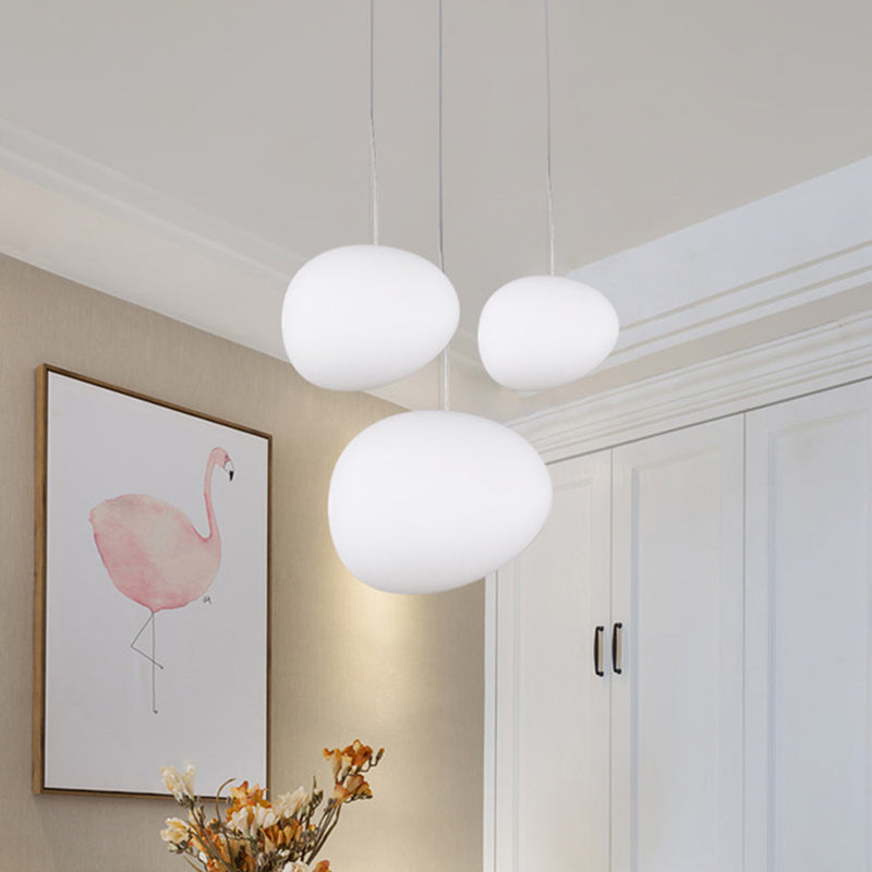 Floating Pebble Dining Room Pendant Lamp Cream Glass 1 Head Minimalist Hanging Ceiling Light in White, 9"/12.5"/18" Wide Clearhalo 'Ceiling Lights' 'Modern Pendants' 'Modern' 'Pendant Lights' 'Pendants' Lighting' 1936795