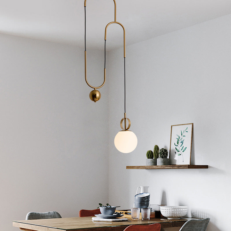 Opaline Glass Ball Shade Pendant Light Kit Postmodern 1-Light Hanging Lamp with Pulley in Gold Gold Clearhalo 'Ceiling Lights' 'Modern Pendants' 'Modern' 'Pendant Lights' 'Pendants' Lighting' 1936824