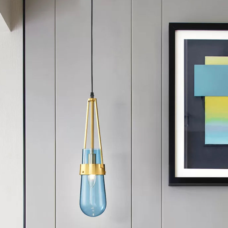 Drop Shaped Dining Room Hanging Lamp Clear/Blue Glass 1 Light Postmodern Pendulum Light with Gripper in Brass Clearhalo 'Ceiling Lights' 'Modern Pendants' 'Modern' 'Pendant Lights' 'Pendants' Lighting' 1937115