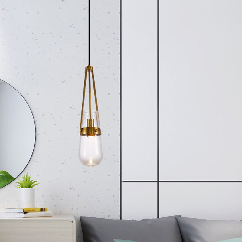 Drop Shaped Dining Room Hanging Lamp Clear/Blue Glass 1 Light Postmodern Pendulum Light with Gripper in Brass Clearhalo 'Ceiling Lights' 'Modern Pendants' 'Modern' 'Pendant Lights' 'Pendants' Lighting' 1937121