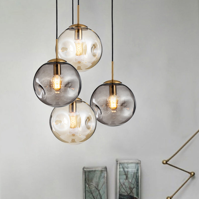 Dimpled Sphere Ceiling Pendant Modern Cognac/Smoke Grey Glass 1 Head Brass Hanging Light Fixture for Living Room Cognac Clearhalo 'Ceiling Lights' 'Glass shade' 'Glass' 'Modern Pendants' 'Modern' 'Pendant Lights' 'Pendants' Lighting' 1937207