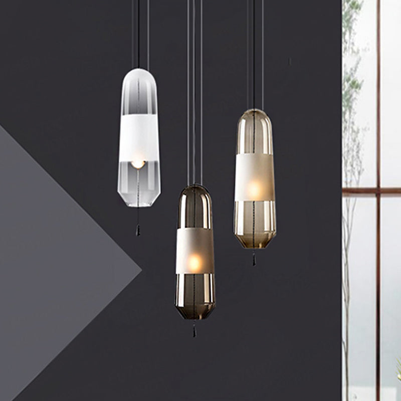 1 Bulb Bedroom Down Lighting Postmodern Black Hanging Pendant with Capsule Clear/Smoke/Amber Glass Shade Clearhalo 'Ceiling Lights' 'Glass shade' 'Glass' 'Modern Pendants' 'Modern' 'Pendant Lights' 'Pendants' Lighting' 1937236
