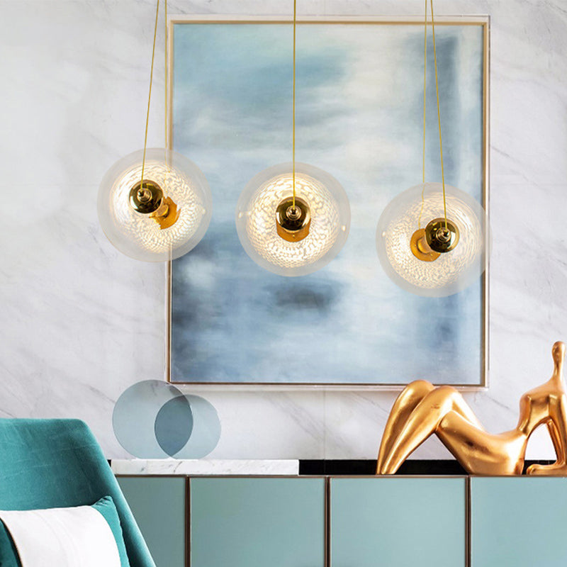Gold Globe Ceiling Pendant Light Modern 1/3-Head Clear Glass Suspension Lighting with Mesh Tube Inside Clearhalo 'Ceiling Lights' 'Close To Ceiling Lights' 'Glass shade' 'Glass' 'Modern Pendants' 'Modern' 'Pendant Lights' 'Pendants' Lighting' 1937623