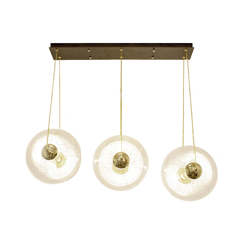Gold Globe Ceiling Pendant Light Modern 1/3-Head Clear Glass Suspension Lighting with Mesh Tube Inside Clearhalo 'Ceiling Lights' 'Close To Ceiling Lights' 'Glass shade' 'Glass' 'Modern Pendants' 'Modern' 'Pendant Lights' 'Pendants' Lighting' 1937624