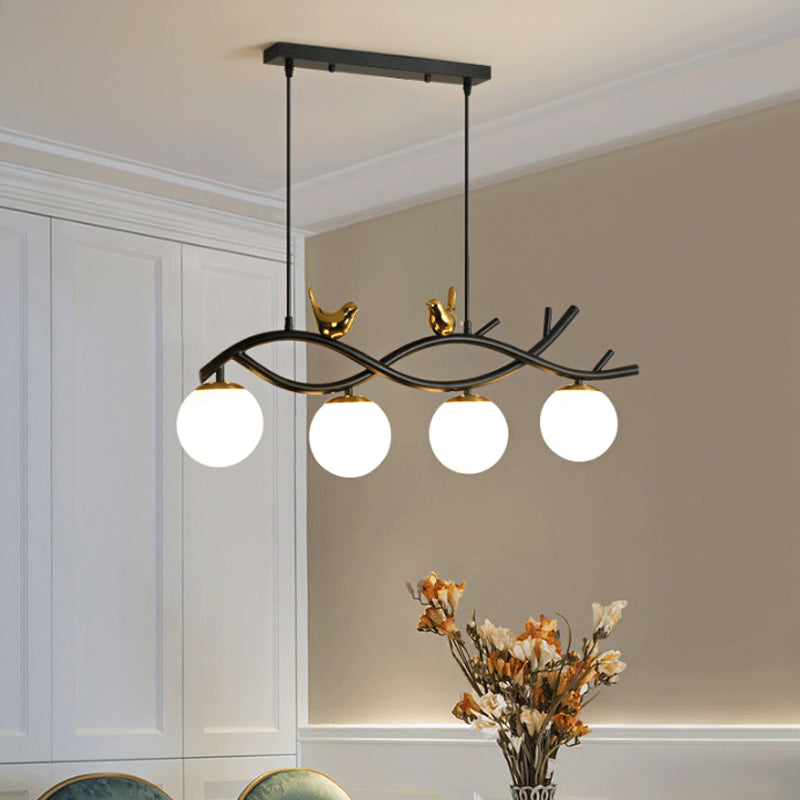 Linear/Branch Dining Room Island Lamp Cream Ball Glass 4 Heads Contemporary Hanging Pendant with Bird Deco in Black-Gold Clearhalo 'Ceiling Lights' 'Glass shade' 'Glass' 'Island Lights' Lighting' 1937633