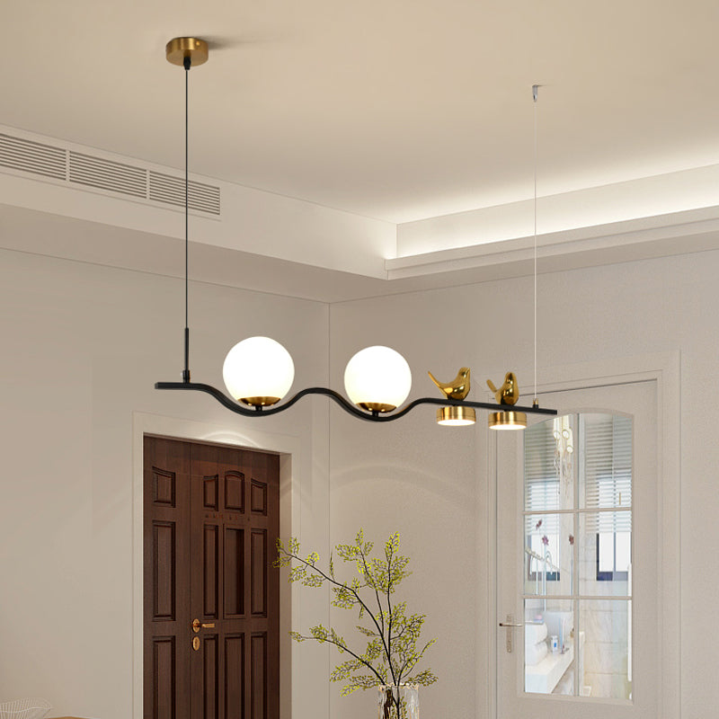 Linear/Branch Dining Room Island Lamp Cream Ball Glass 4 Heads Contemporary Hanging Pendant with Bird Deco in Black-Gold Clearhalo 'Ceiling Lights' 'Glass shade' 'Glass' 'Island Lights' Lighting' 1937637