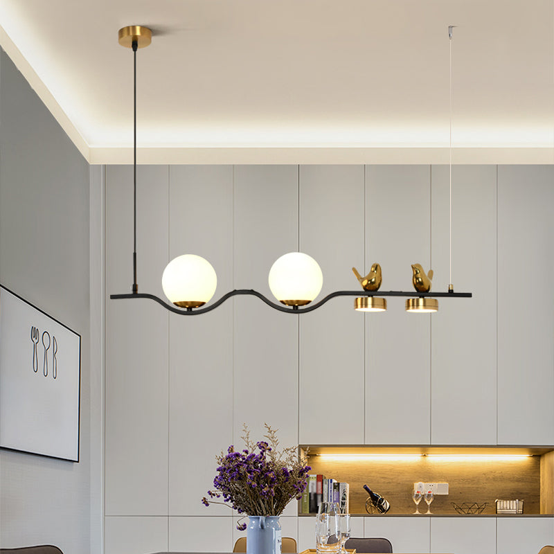 Linear/Branch Dining Room Island Lamp Cream Ball Glass 4 Heads Contemporary Hanging Pendant with Bird Deco in Black-Gold Clearhalo 'Ceiling Lights' 'Glass shade' 'Glass' 'Island Lights' Lighting' 1937638