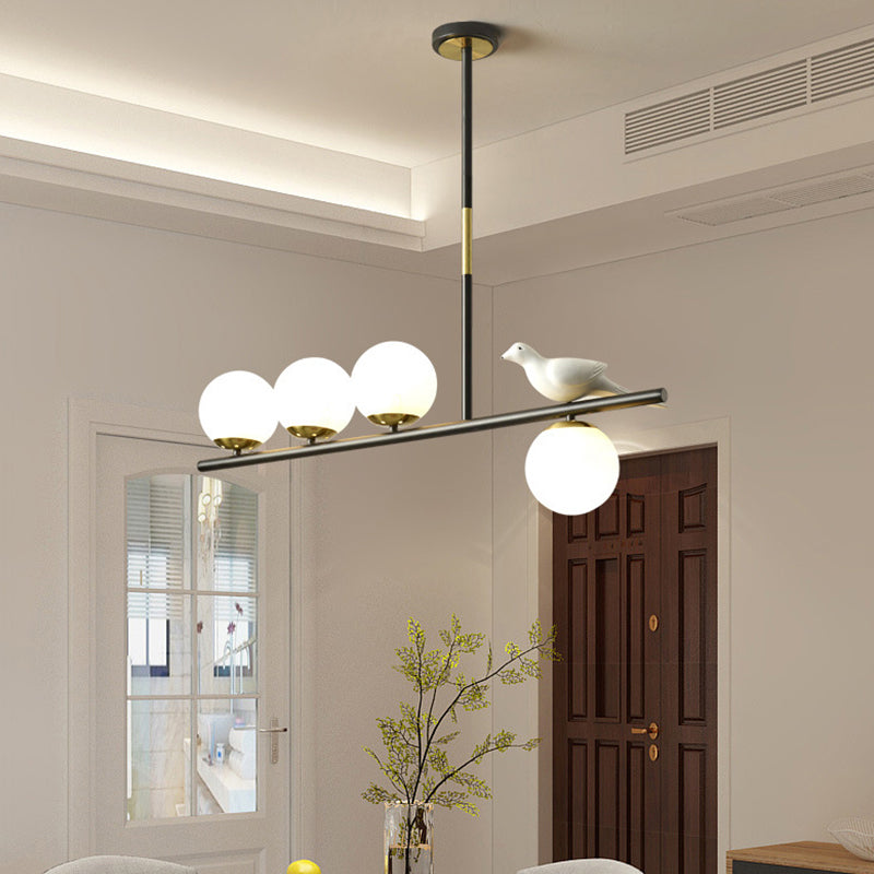 Linear/Branch Dining Room Island Lamp Cream Ball Glass 4 Heads Contemporary Hanging Pendant with Bird Deco in Black-Gold Black C Clearhalo 'Ceiling Lights' 'Glass shade' 'Glass' 'Island Lights' Lighting' 1937641