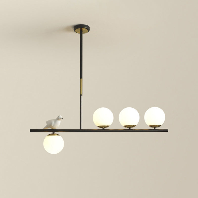 Linear/Branch Dining Room Island Lamp Cream Ball Glass 4 Heads Contemporary Hanging Pendant with Bird Deco in Black-Gold Clearhalo 'Ceiling Lights' 'Glass shade' 'Glass' 'Island Lights' Lighting' 1937643