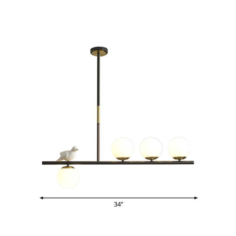 Linear/Branch Dining Room Island Lamp Cream Ball Glass 4 Heads Contemporary Hanging Pendant with Bird Deco in Black-Gold Clearhalo 'Ceiling Lights' 'Glass shade' 'Glass' 'Island Lights' Lighting' 1937644