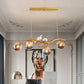 Metal Branch Hanging Lamp Contemporary 4-Light Black/Gold Island Pendant with Bird Deco and Smoke Grey/Cognac Glass Shade Clearhalo 'Ceiling Lights' 'Glass shade' 'Glass' 'Island Lights' Lighting' 1937737