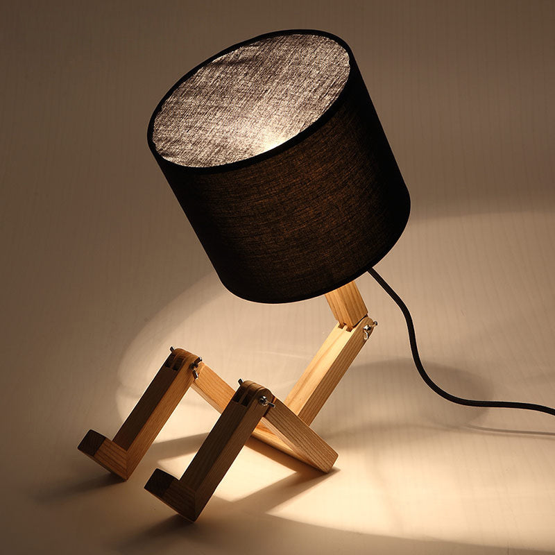 Man-Shaped Table Lamp Novelty Modern Wood Single Beige/Black/White Night Light with Book Rack Design and Cylinder Fabric Shade Black Clearhalo 'Lamps' 'Table Lamps' Lighting' 1949335