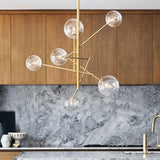 Spherical Kitchen Bar Ceiling Chandelier Clear Glass 6-Bulb Postmodern Hanging Light in Gold Clearhalo 'Ceiling Lights' 'Chandeliers' 'Modern Chandeliers' 'Modern' Lighting' 1949767